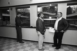 Brad Aichison, Principal of the school that burned down, going over his new home, Marian High School, with Bill Low, District 43's manager of facilities; and Don Pegura