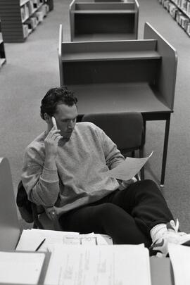 People studying at the Coquitlam Public Library during a rainy day.