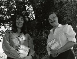 Brenda Gillespie and Val Adolf holding their book "The Riverview Lands"