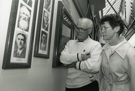 People looking at portraits of former Reeves and Mayors