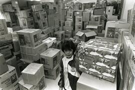 Elizabeth Gregc of Coquitlam with boxes of stuff being sent to Croatia for Christmas.