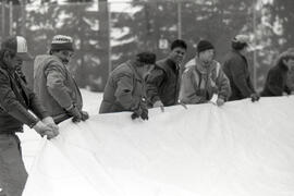 Work crews struggle to position the tarps that will be inflated to create new tennis dome at Coquitlam Rec Centre, on Poirier