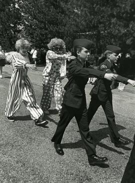 Clowns and cadets marching