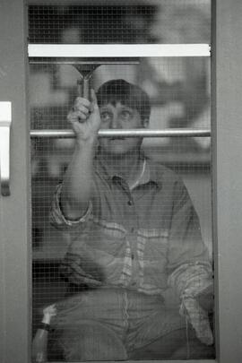 Baker Elem. Caretaker Cathy Caldwell doing windows