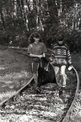 Joy Appler and Jaimee Dirksen team up to haul garbage out of Stoney Creek, part of BC Rivers day