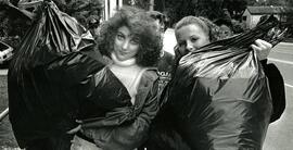 Green Girls Laura Pavan (left) and Erin Gastor head back to Montgomery Secondary after collecting garbage in Mundy Park for Pitch-In week.