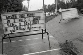 Social corner of the month. Signs on the corner of Shaughessy and Lougheed