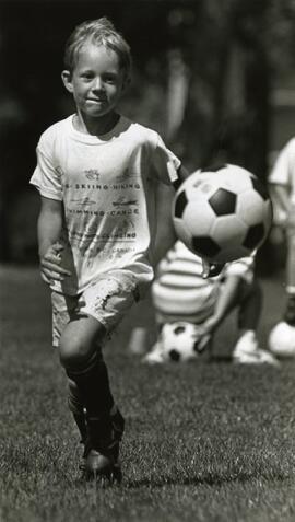 Jon Sievenpiper, 6, chases down a bouncing ball.