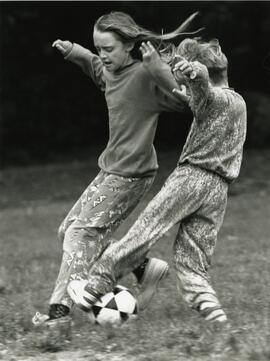 April Reed, 10, and Ryan Cassels, 9, playing soccer at Bellcara Park.