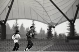 Joggers at Coquitlam Town Centre Stadium