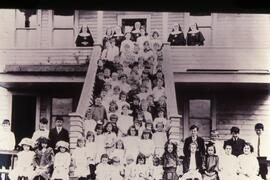 Children standing in  front of the church